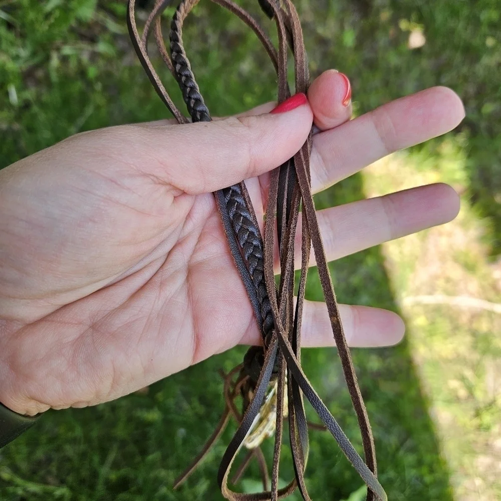 brown leather cord necklace with oversized silver and gold tone cross pendant